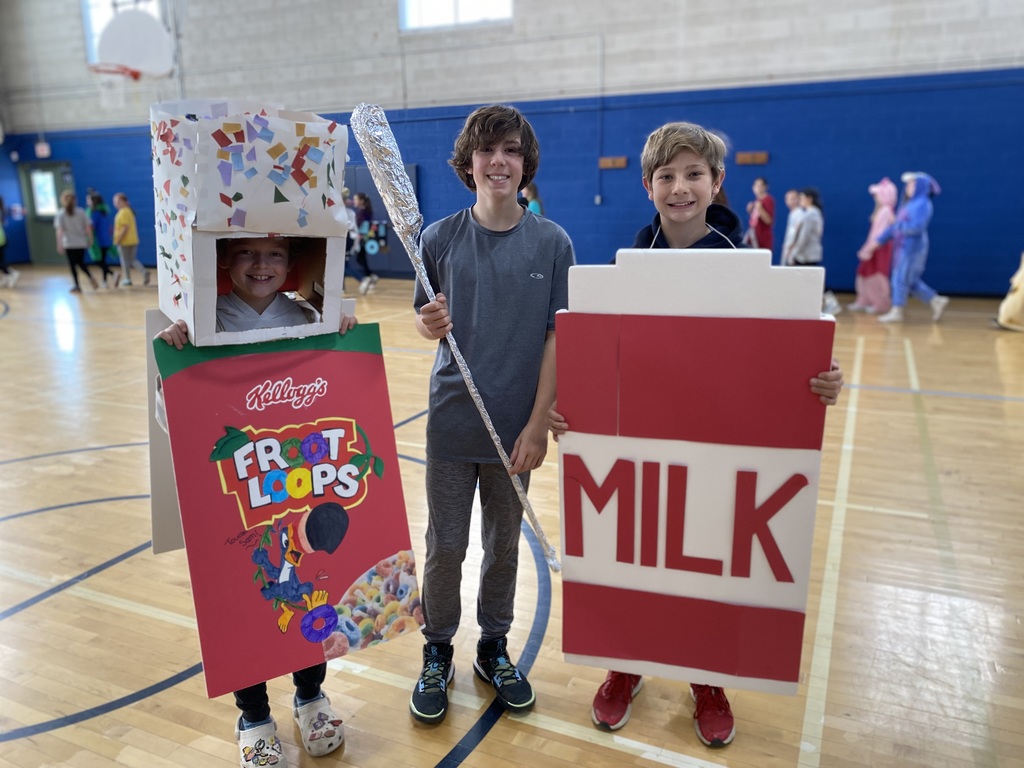 Students dressed as cereal. a spoon and milk