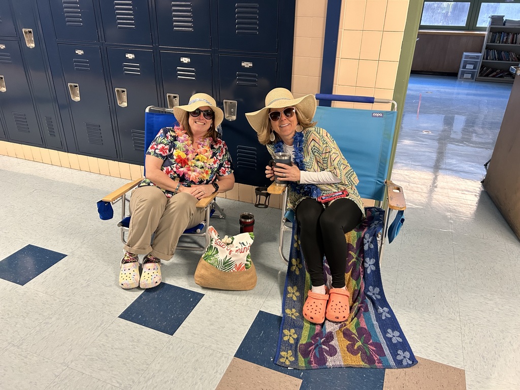 Two teachers sitting in beach chairs