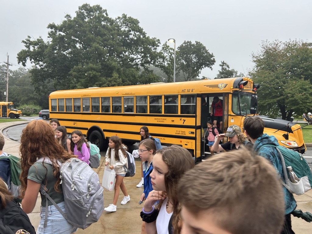 Students arriving to school by bus